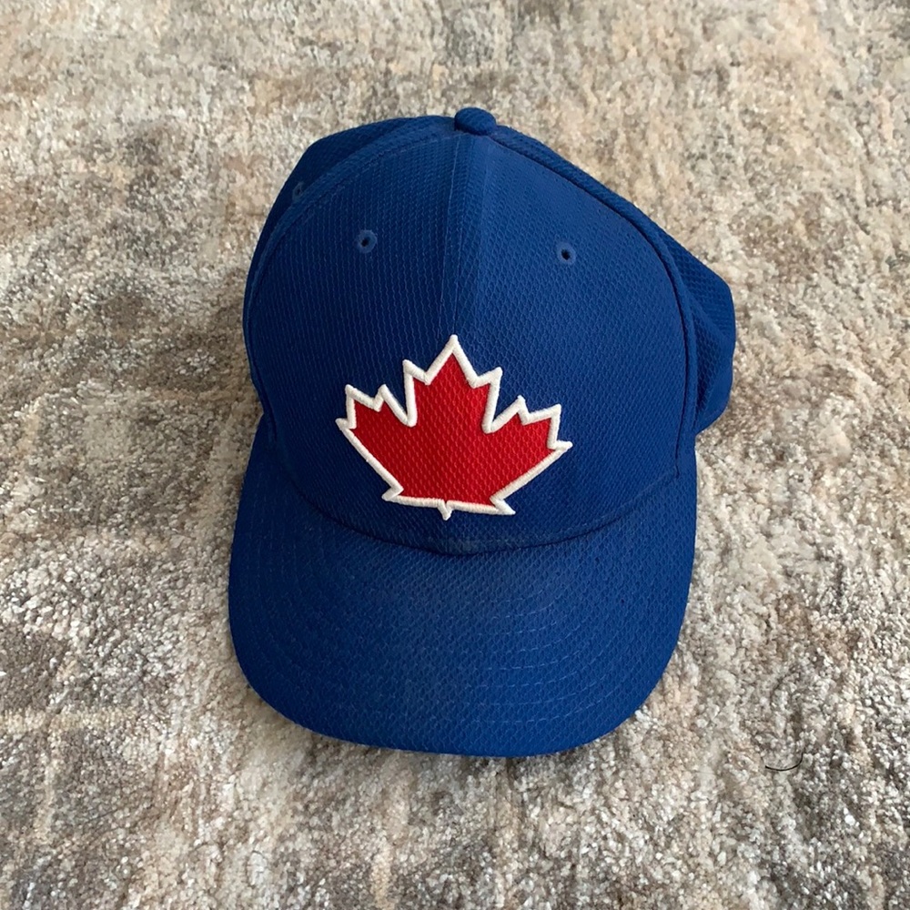 New Era Blue Baseball Cap with Red Maple Leaf Patch